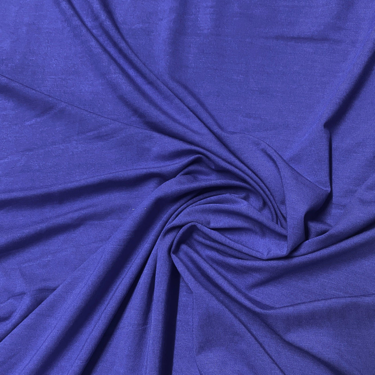Swirl of premium royal blue natural fabric from Nature's Fabrics.