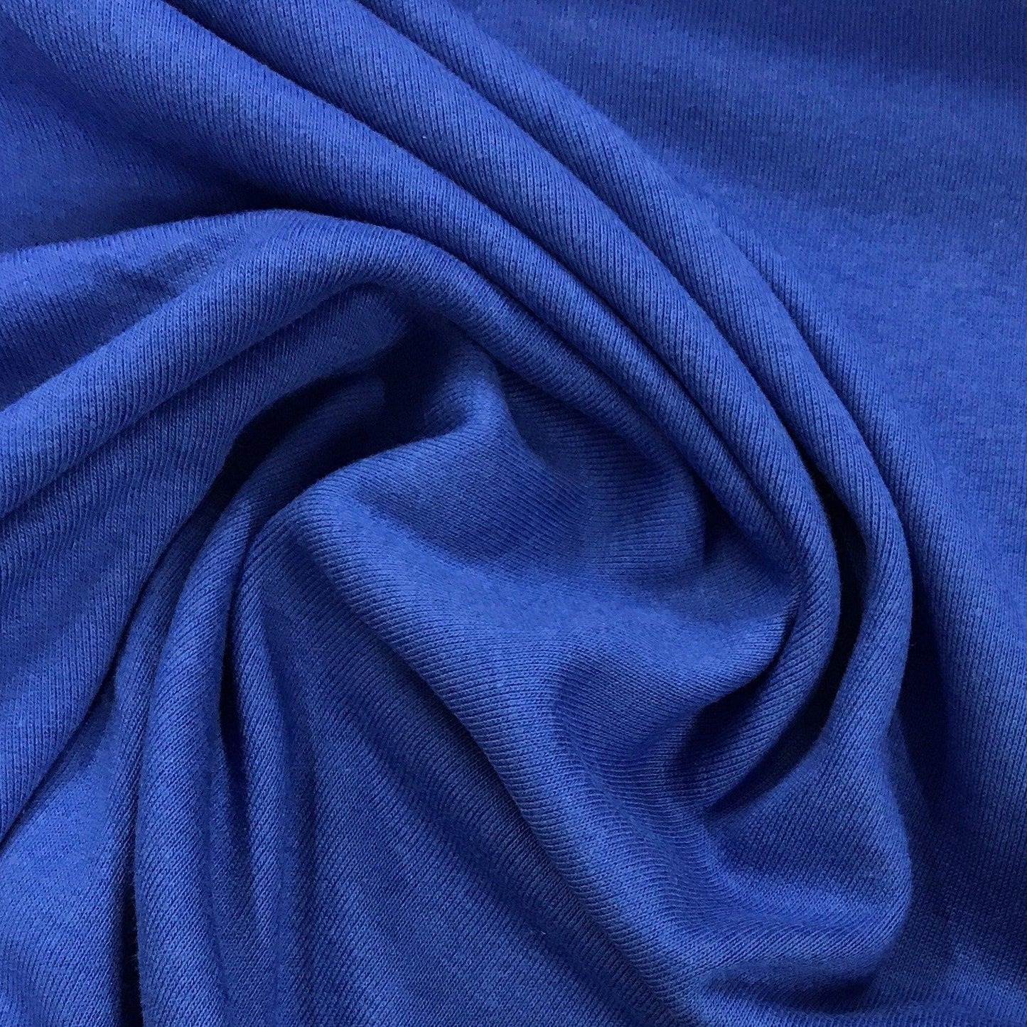 Close-up of draped royal blue organic cotton fabric from Nature's Fabrics
