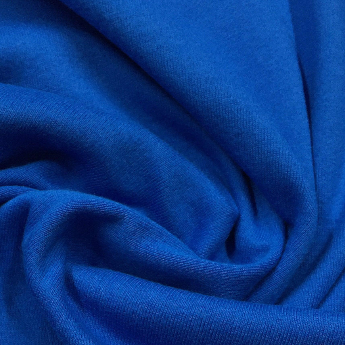 Close-up of draped royal blue premium natural fabric from Nature's Fabrics.