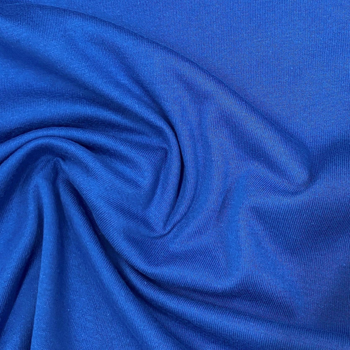 Close-up of draped royal blue premium natural fabric from Nature's Fabrics.