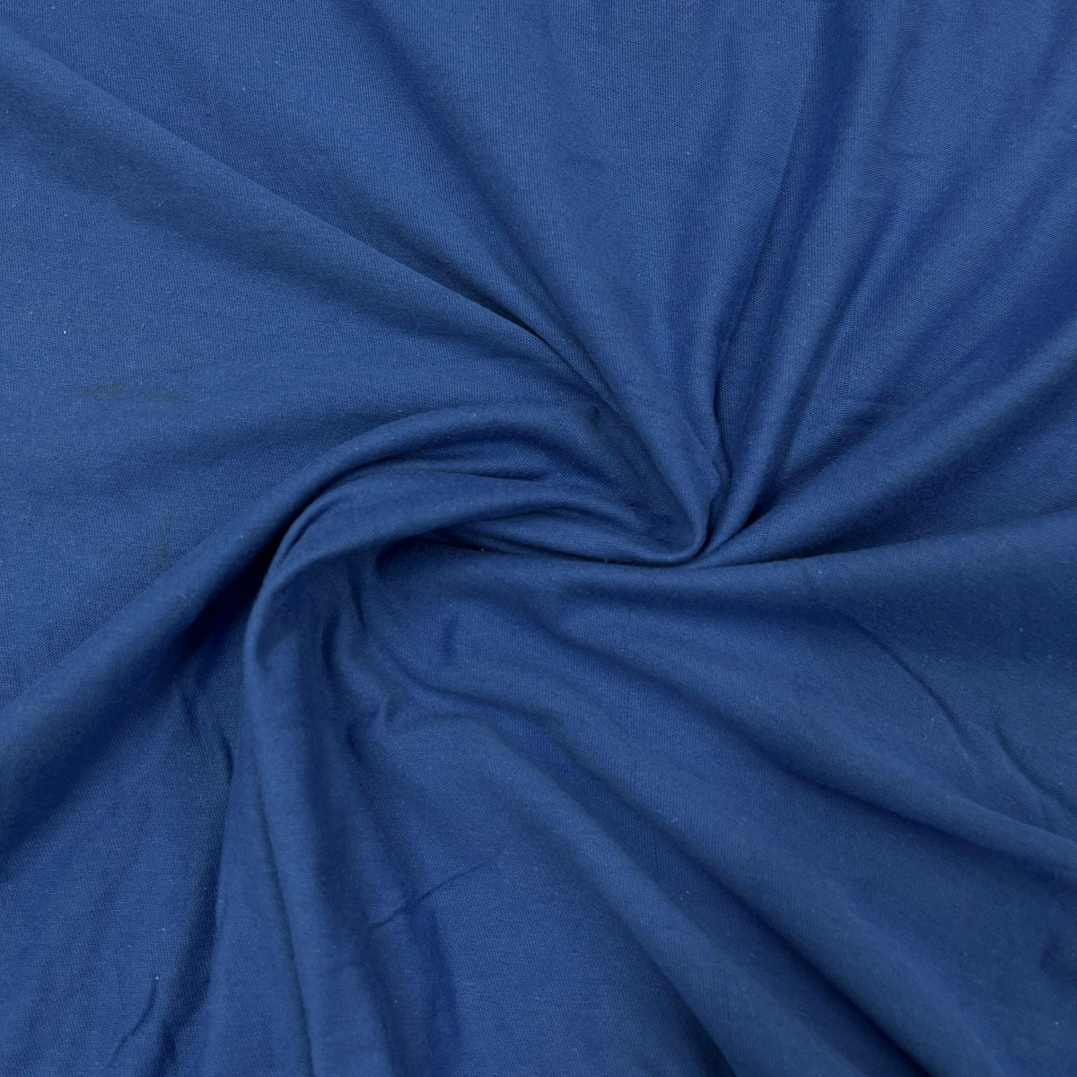 Nature's Fabrics royal blue organic cotton fabric with a swirled texture