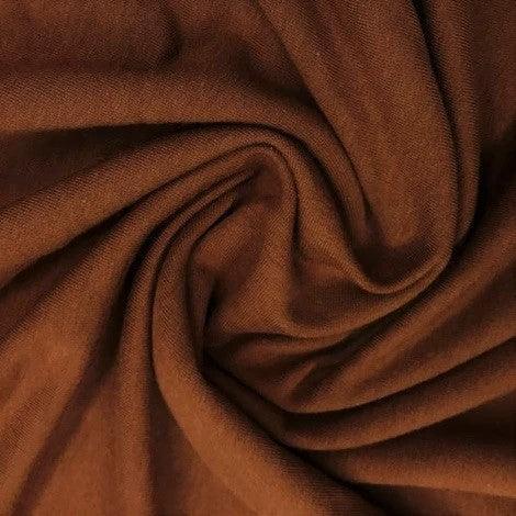 Close-up of draped brown natural fabric from Nature's Fabrics.