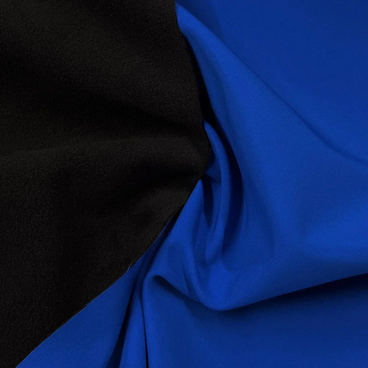 Nature's Fabrics premium black and royal blue natural fabric draped side by side.