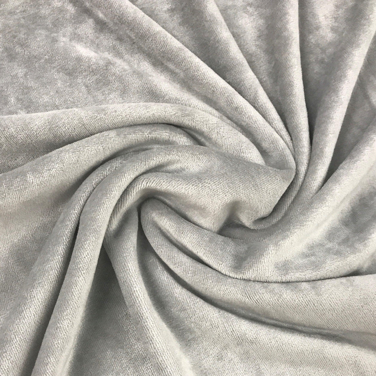 Close-up of draped, light grey velvet fabric from Nature's Fabrics.