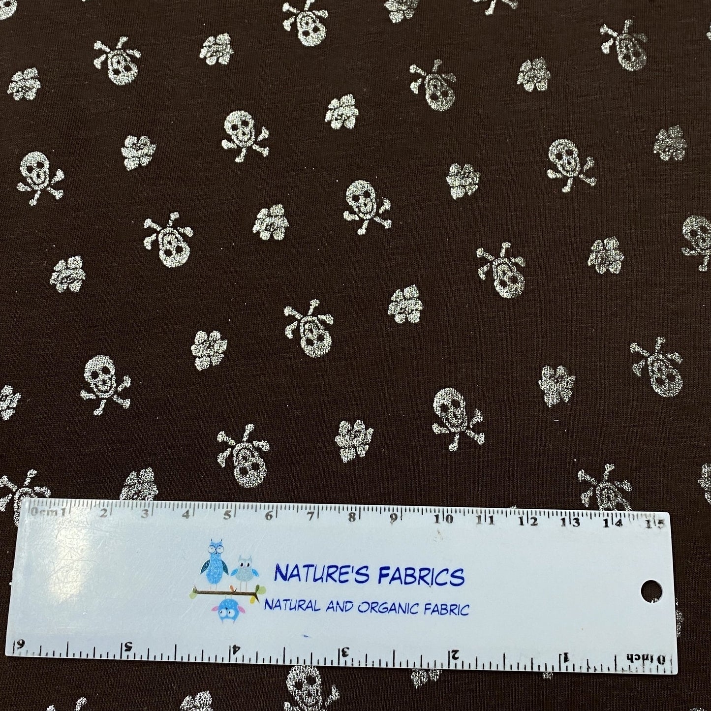 Silver Skulls on Brown Cotton/Spandex Jersey - Nature's Fabrics