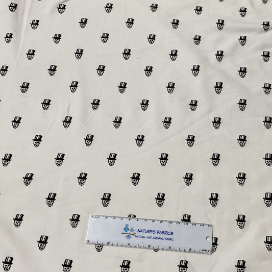 Small Black Skulls on White Cotton/Spandex Jersey Fabric - Nature's Fabrics