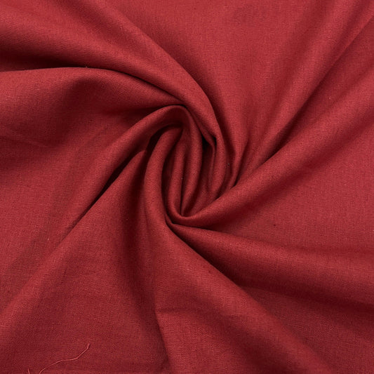 Nature's Fabrics red natural fabric draped in a spiral pattern