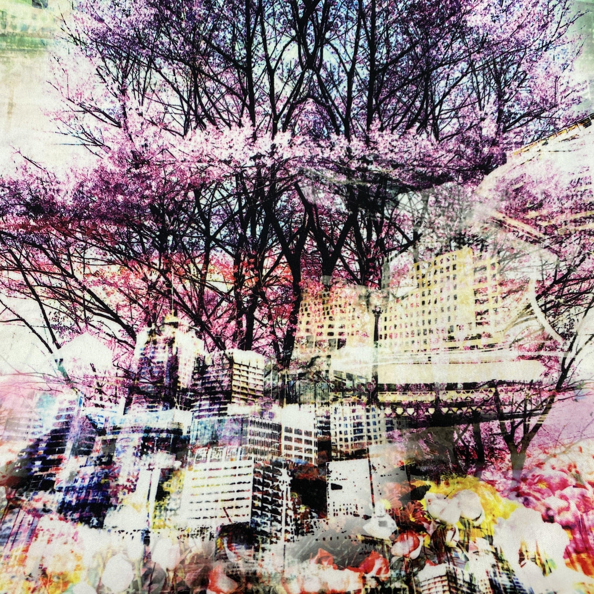 Nature's Fabrics abstract double exposure of purple cherry blossoms and a city skyline.