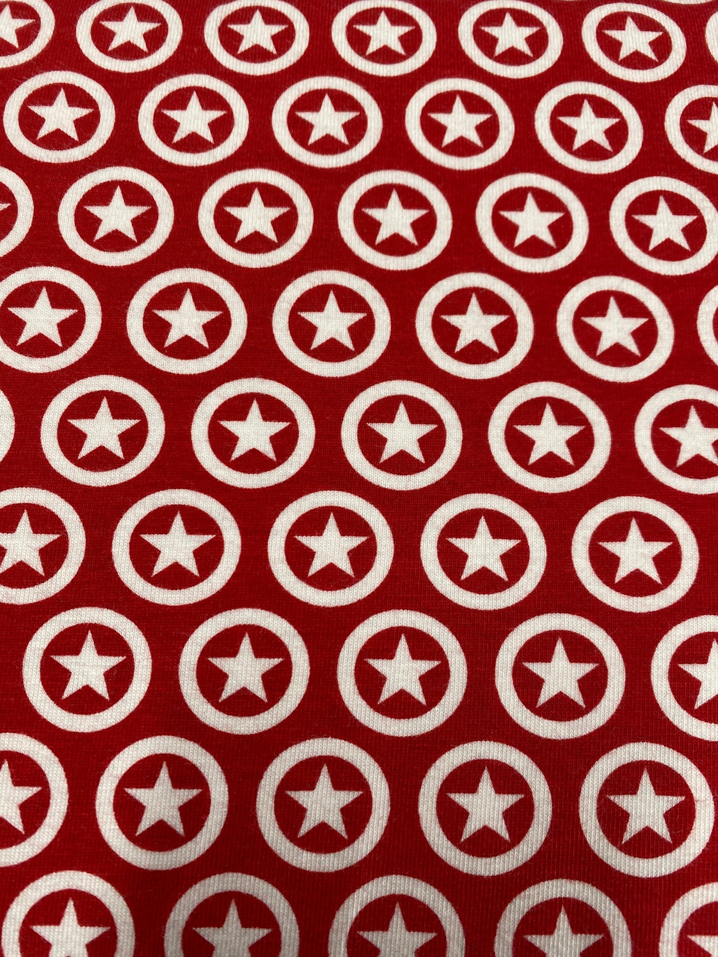 Star Circle on Cream Cotton/Spandex Jersey Fabric - Nature's Fabrics