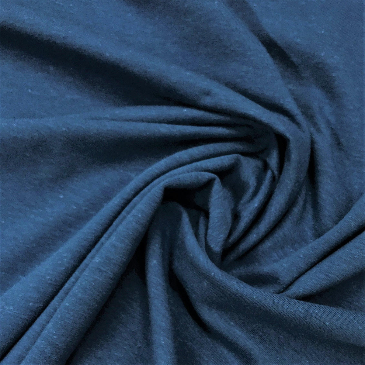 Close-up of draped navy blue organic fabric from Nature's Fabrics.