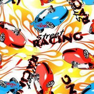 Nature's Fabrics street racing patterned fabric with red and blue cartoon cars and flames.