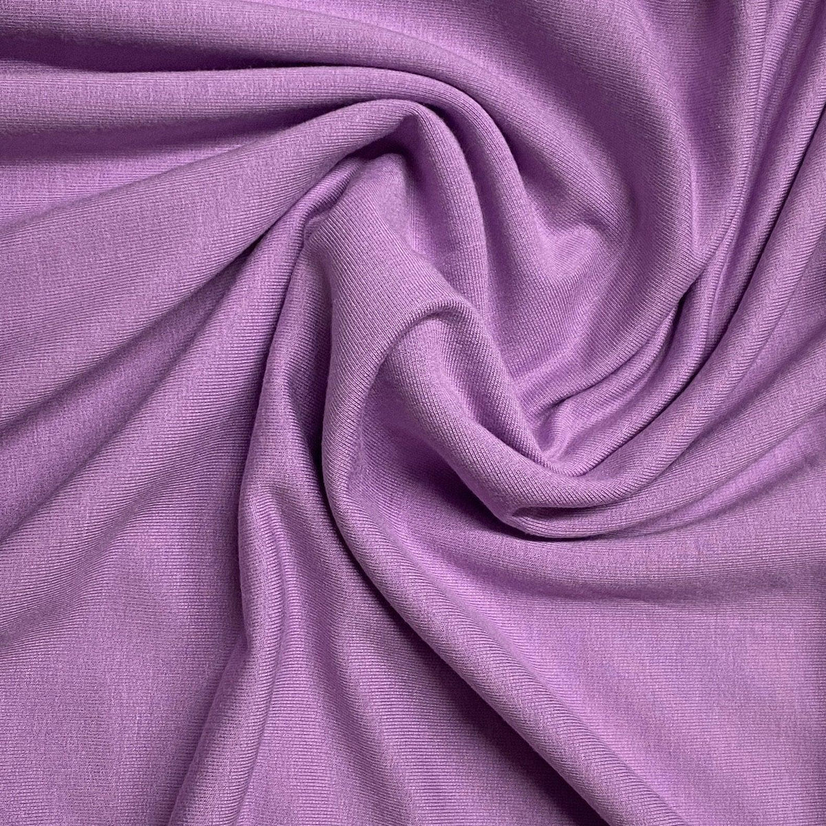 Close-up of draped purple premium natural fabric from Nature's Fabrics