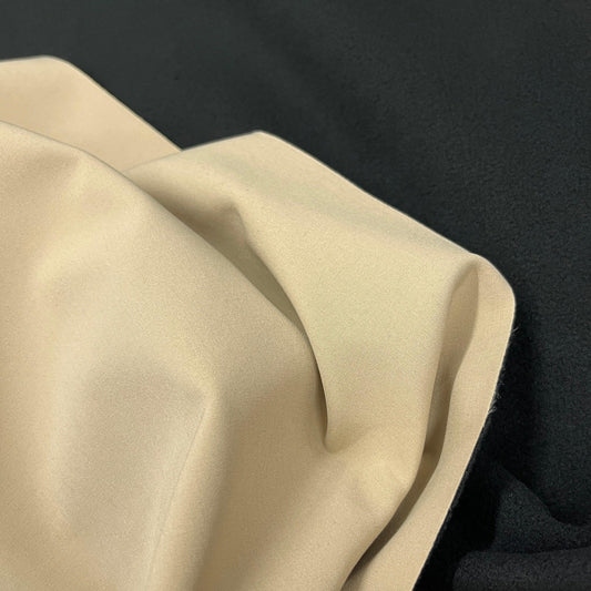 Close-up of draped beige premium natural fabric from Nature's Fabrics.
