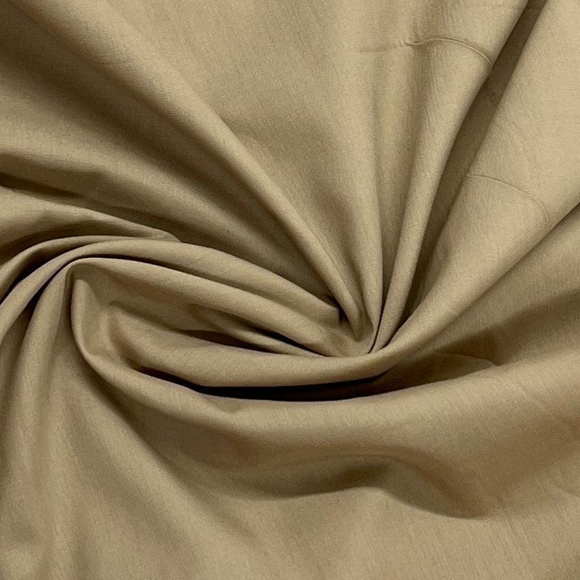 Draped tan organic cotton fabric from Nature's Fabrics