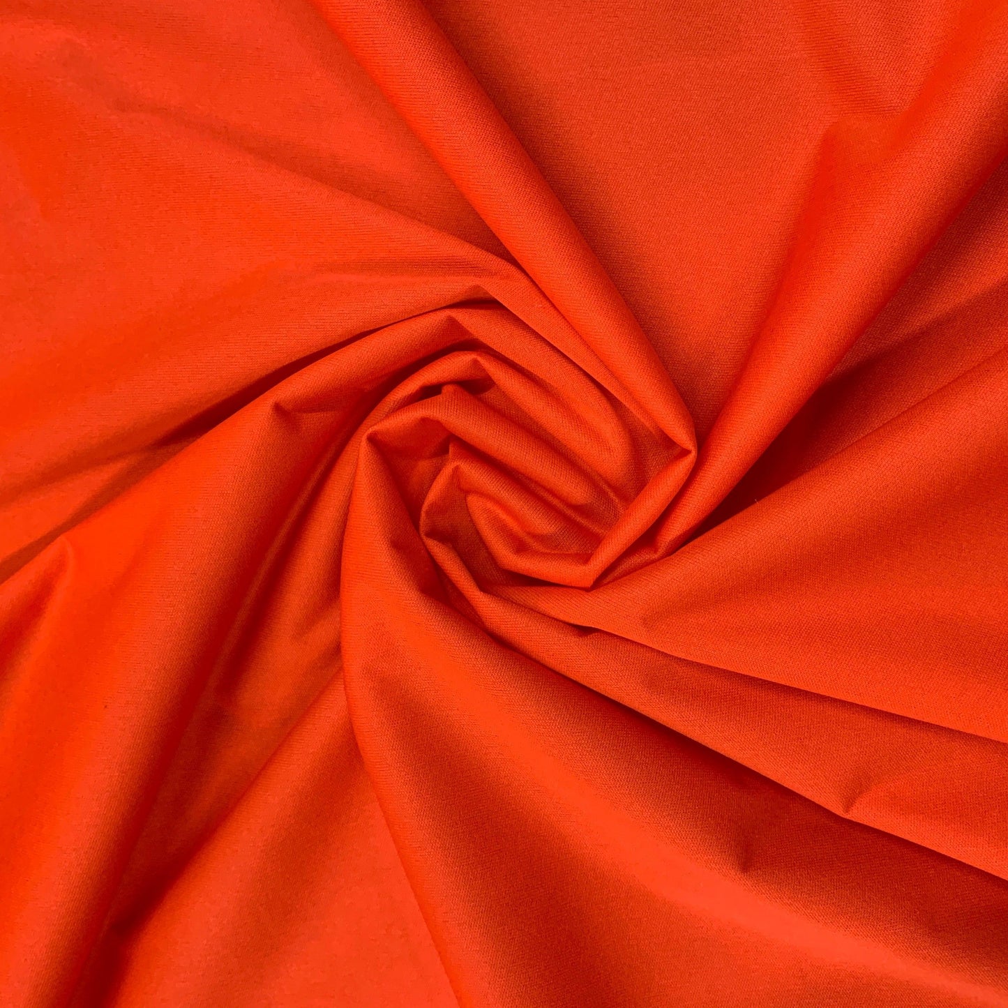 Swirl of vibrant orange premium fabric from Nature's Fabrics