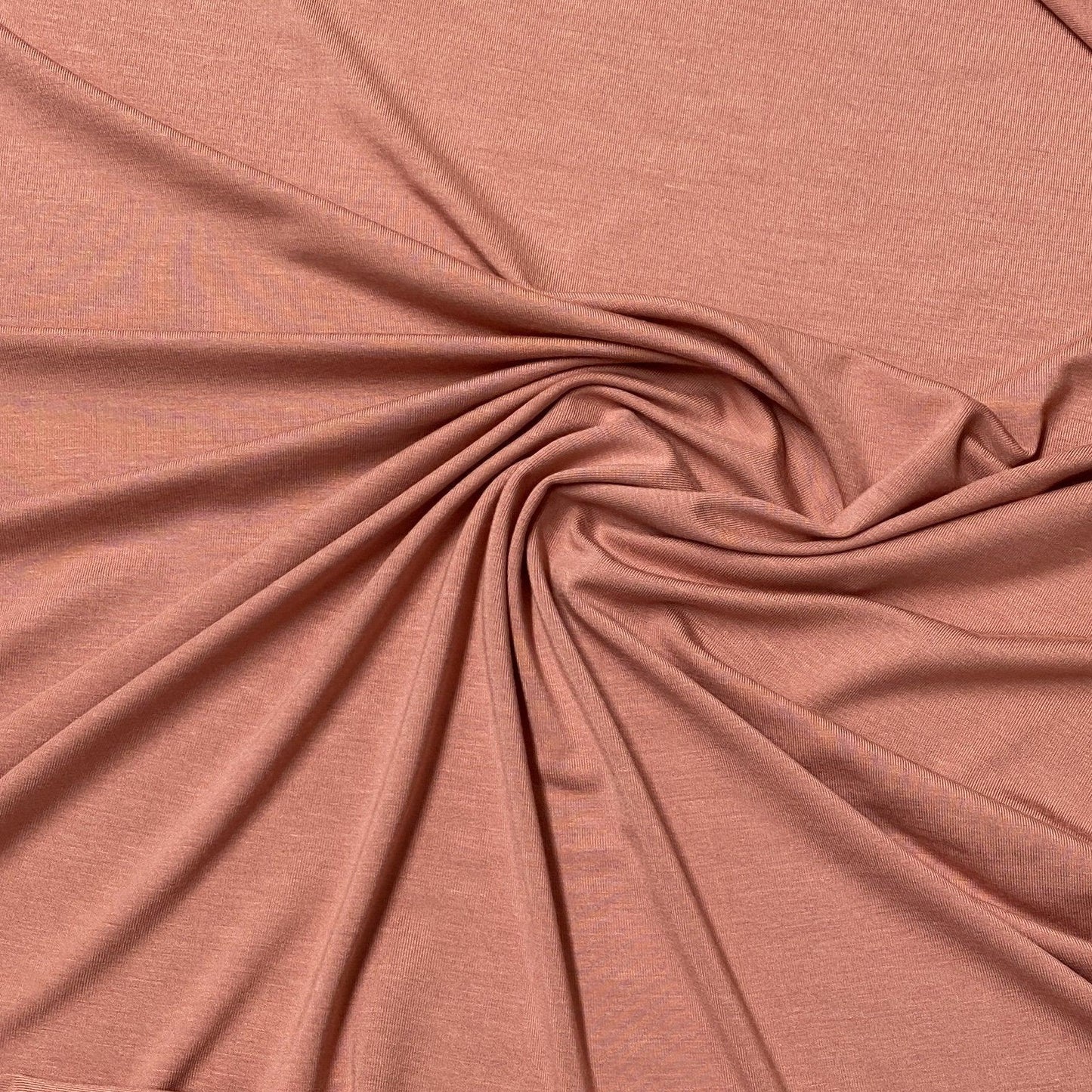 Nature's Fabrics dusty rose organic natural fabric with elegant swirl drapes.
