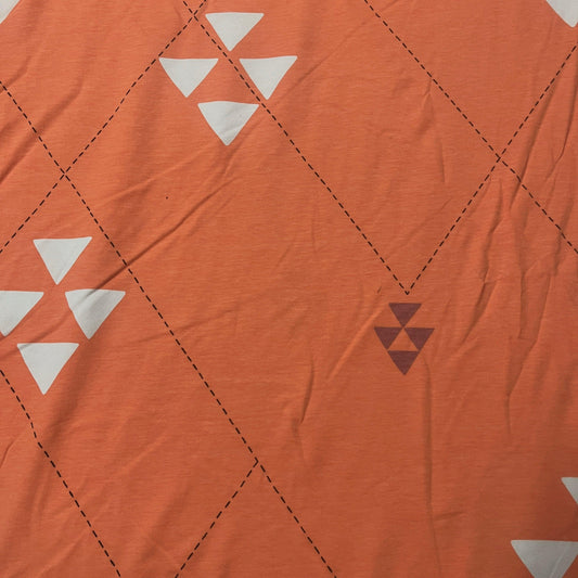 Triangles on Peach Organic Cotton/Spandex Jersey Fabric - Nature's Fabrics