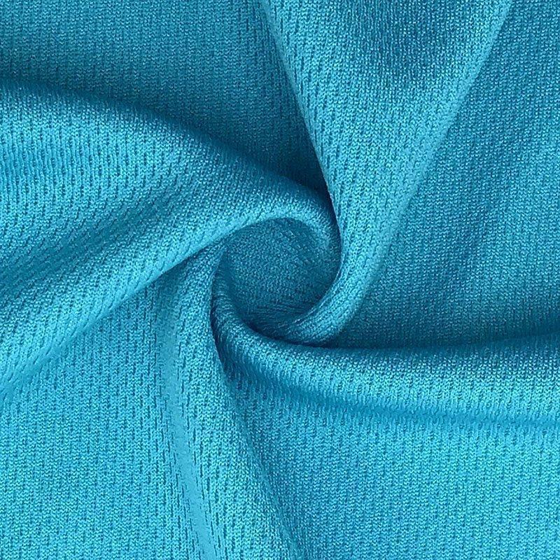 Close-up of draped teal blue natural fabric from Nature's Fabrics