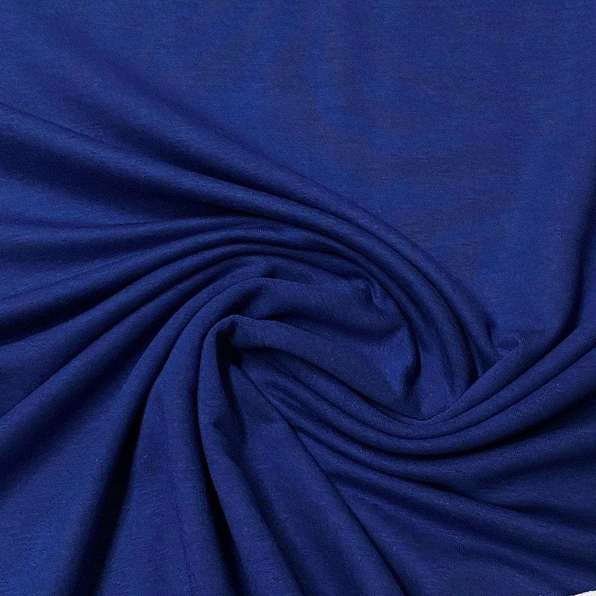 Royal blue natural fabric draped in swirls from Nature's Fabrics