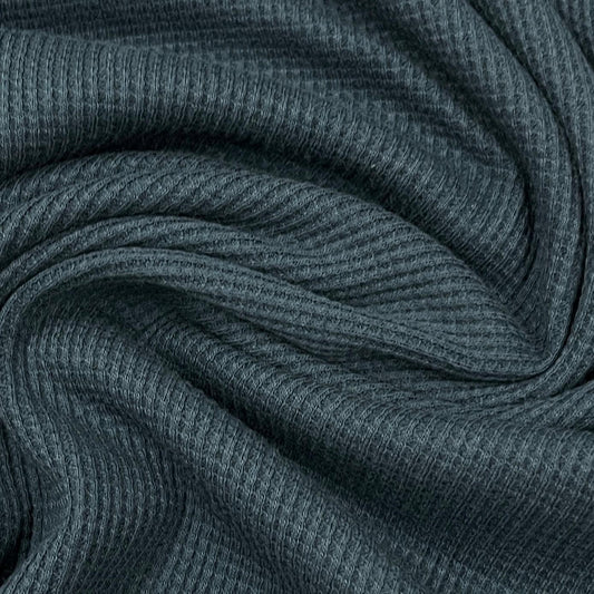 Close-up of charcoal grey ribbed natural fabric from Nature's Fabrics.