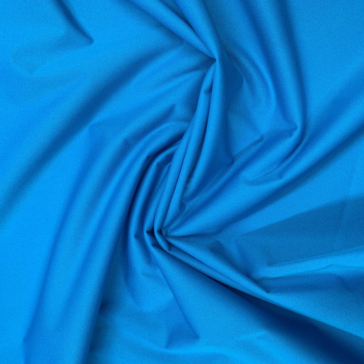 Draped vibrant blue natural fabric from Nature's Fabrics.
