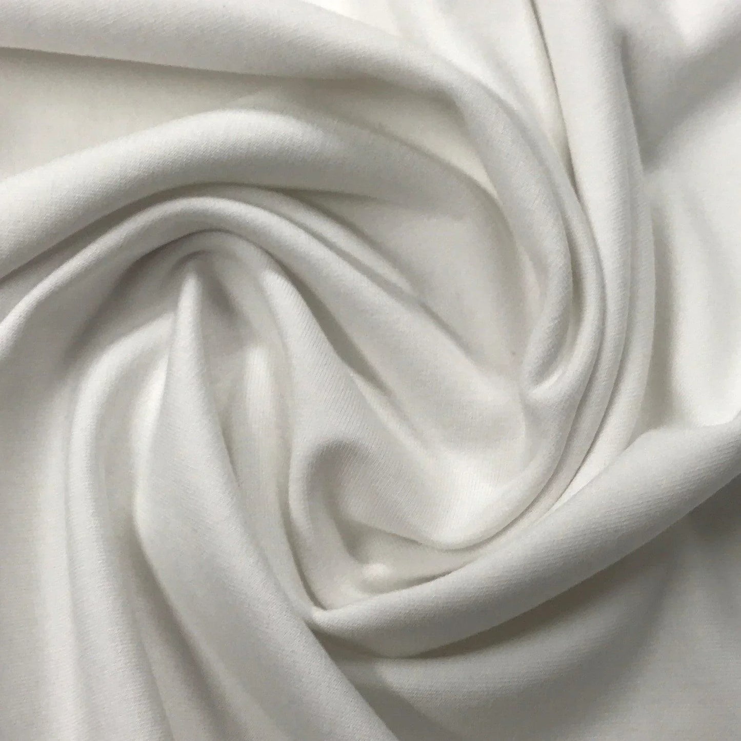 Close-up of draped white premium natural fabric from Nature's Fabrics
