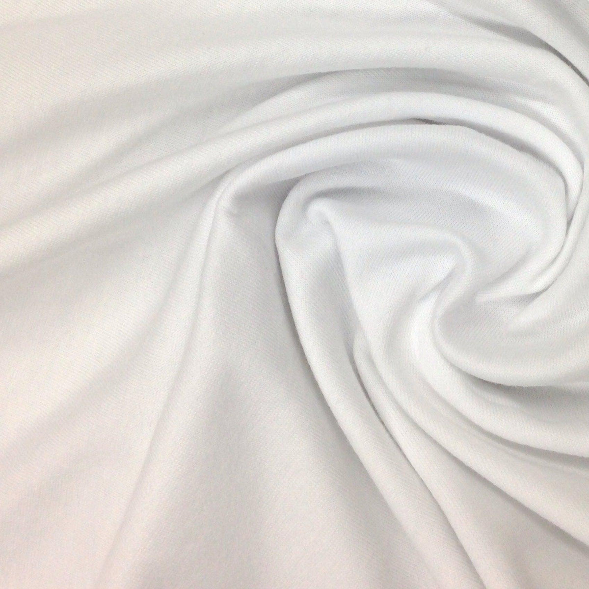 Close-up of draped white organic cotton fabric from Nature's Fabrics