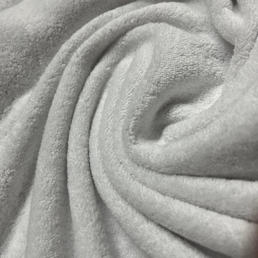 Close-up of soft, swirled grey plush fabric from Nature's Fabrics.