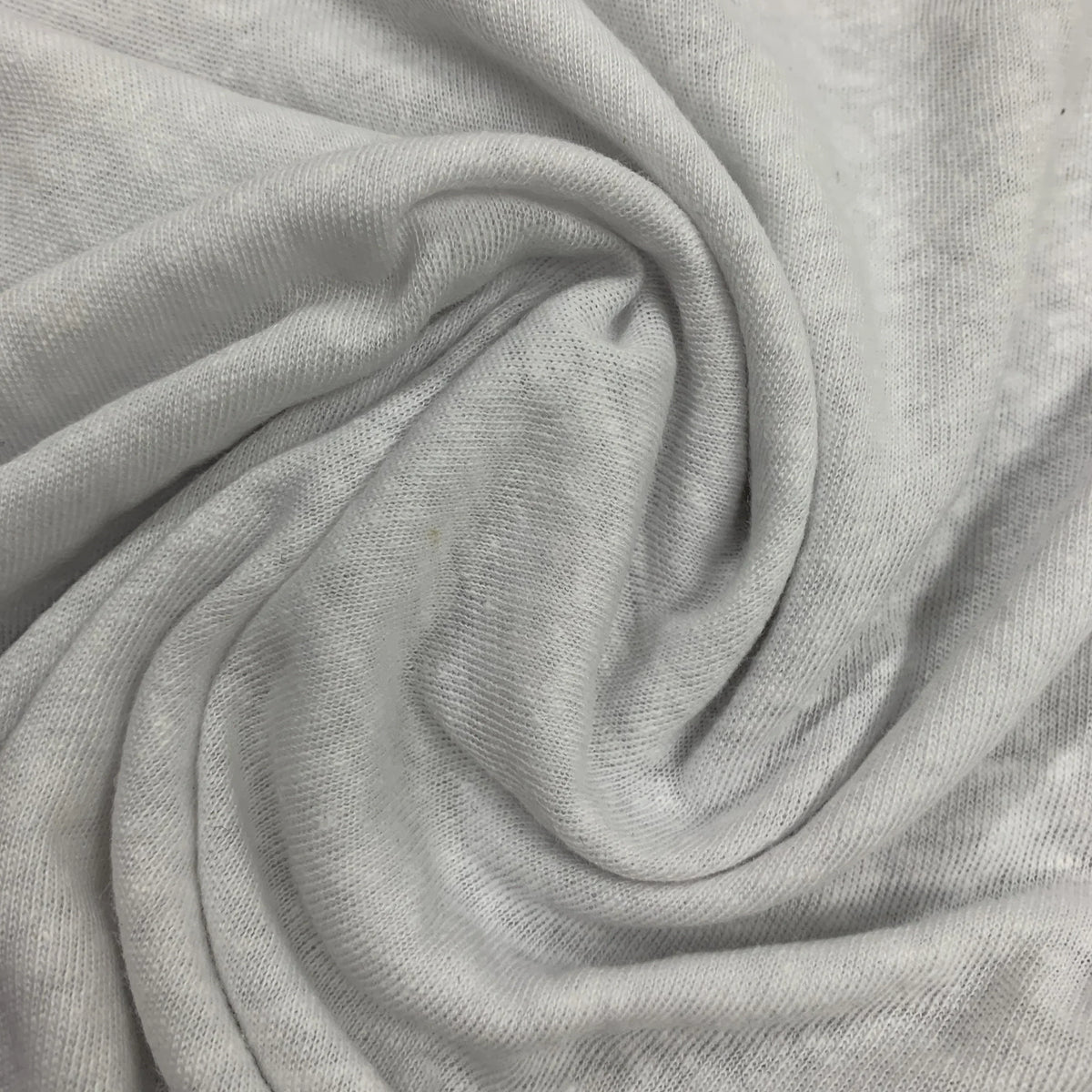Close-up of draped white organic cotton fabric from Nature's Fabrics