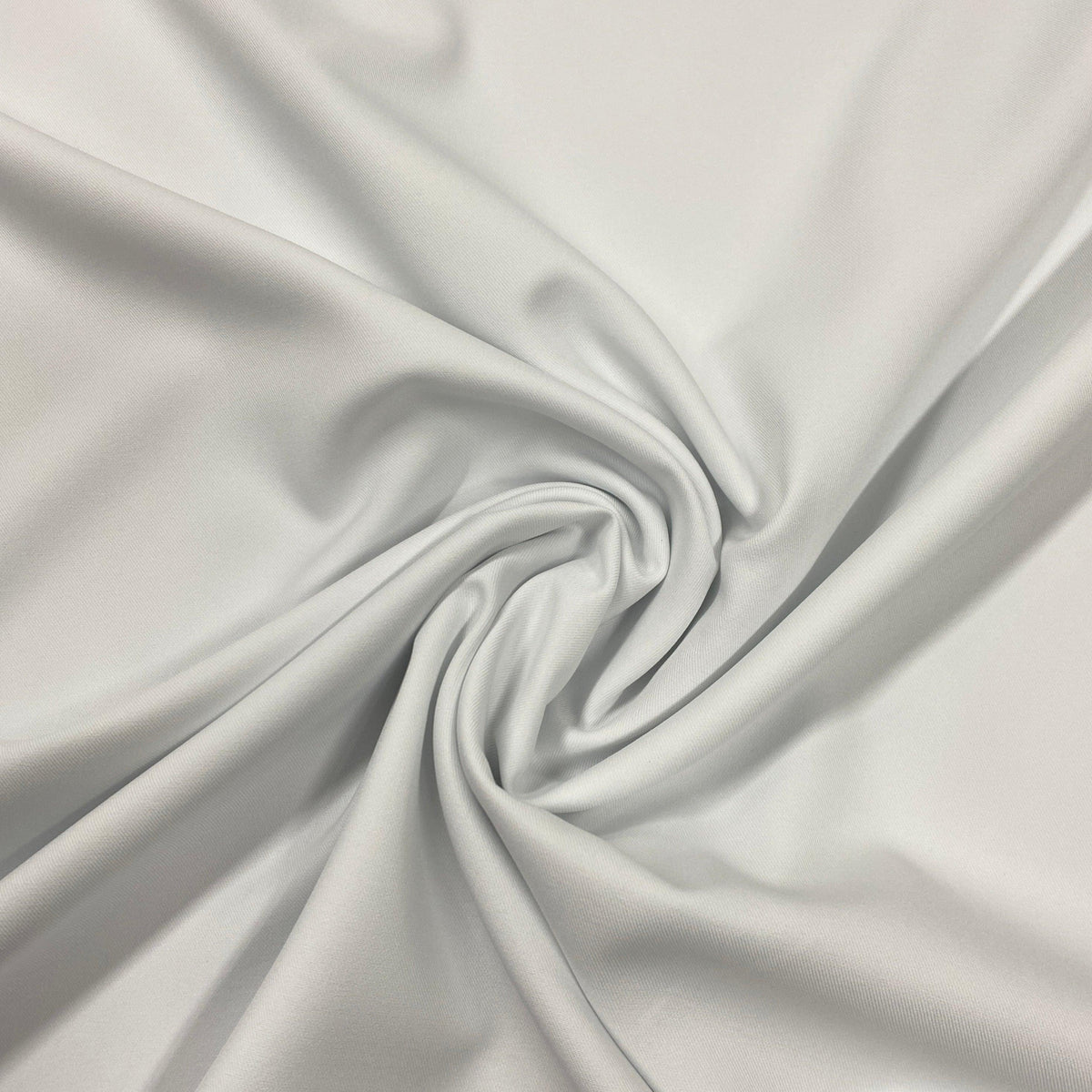 Close-up of draped white premium natural fabric from Nature's Fabrics.