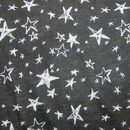 Nature's Fabrics black cotton fabric with a white hand-drawn star print.