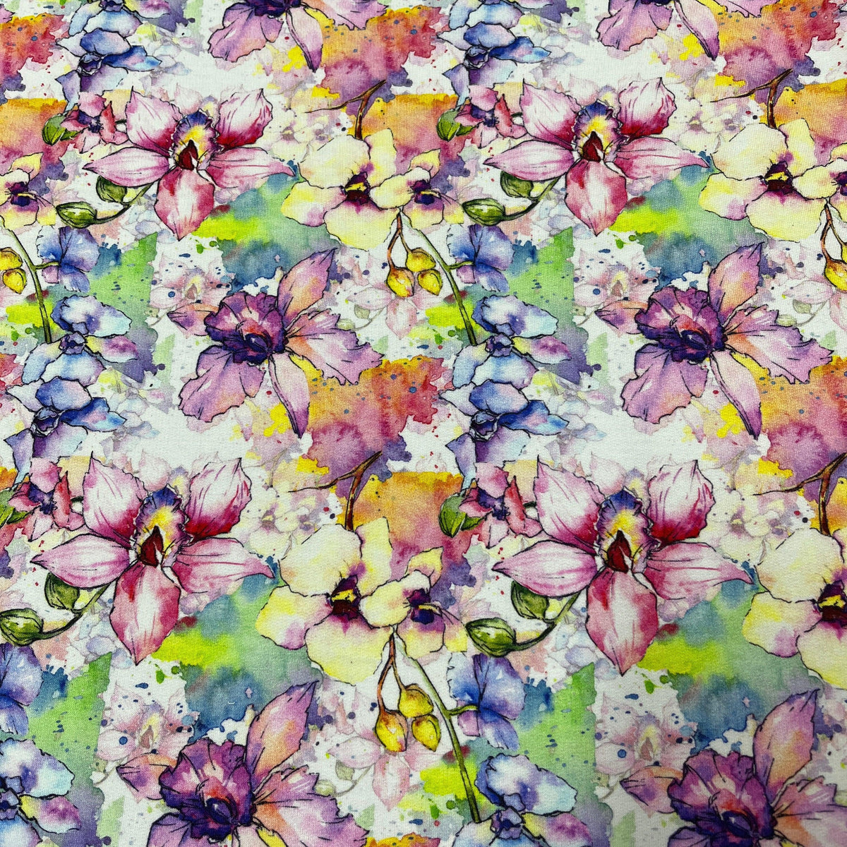 Watercolor floral print fabric from Nature's Fabrics featuring pink and purple orchids.