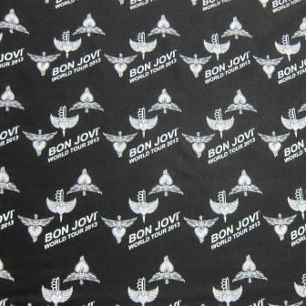 Black Nature's Fabrics fabric with white Bon Jovi World Tour 2013 logo pattern