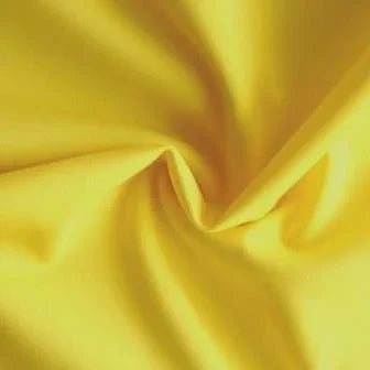 Close-up of draped yellow natural fabric from Nature's Fabrics