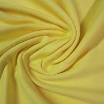 Close-up of draped yellow natural fabric from Nature's Fabrics