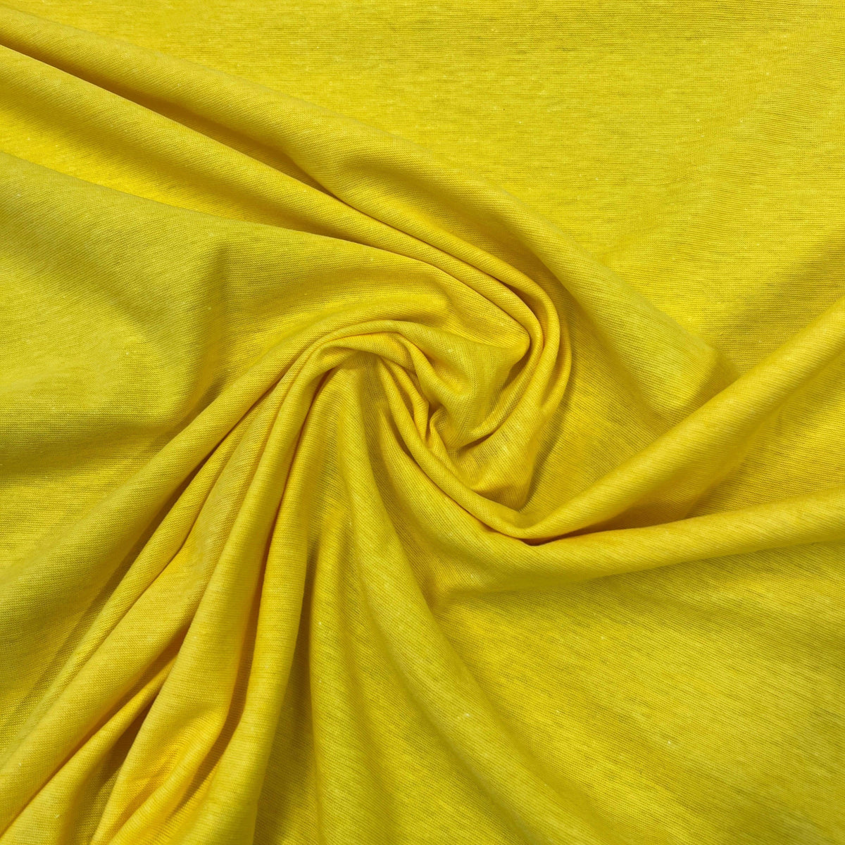 Swirled bright yellow organic cotton fabric from Nature's Fabrics