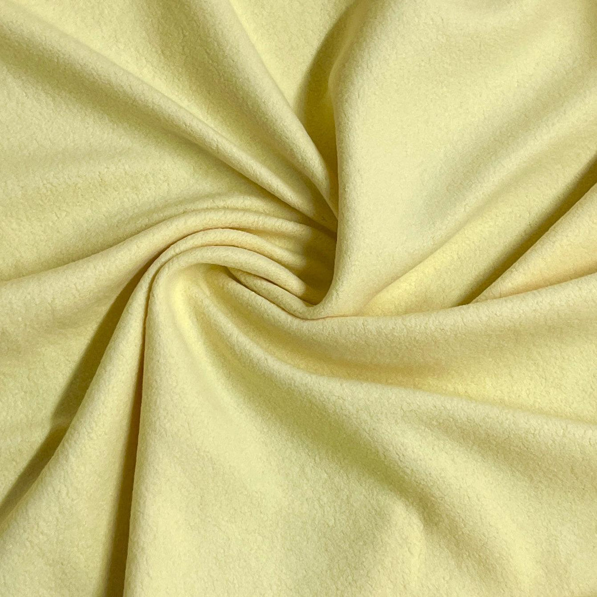 Close-up of draped pale yellow natural fabric from Nature's Fabrics
