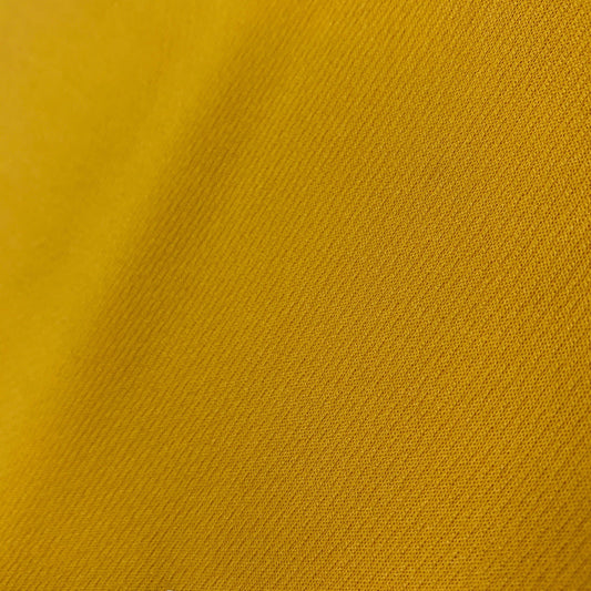 Close-up of a yellow textured fabric from Nature's Fabrics.