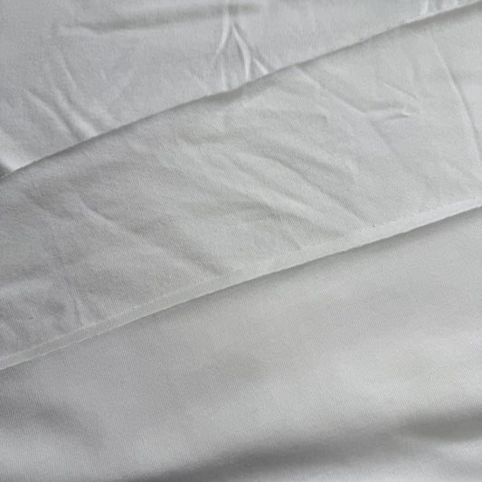 Close-up of bamboo jersey and cotton jersey white fabric texture comparison.