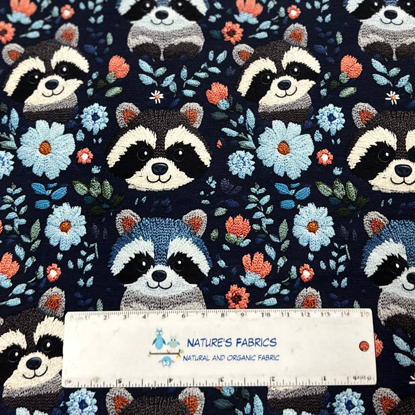 Embroidered Raccoons on Blue Bamboo/Spandex Jersey Fabric