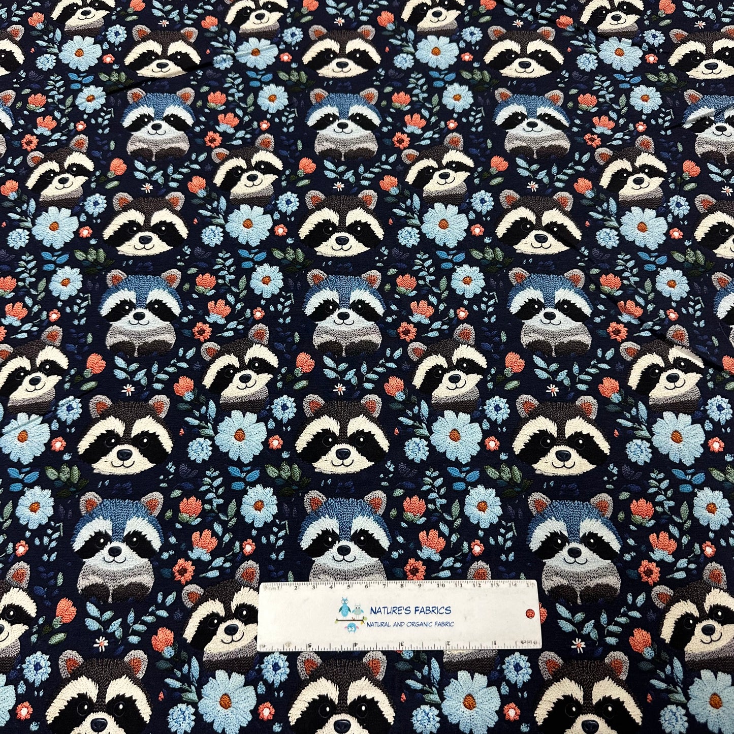 Embroidered Raccoons on Blue Bamboo/Spandex Jersey Fabric