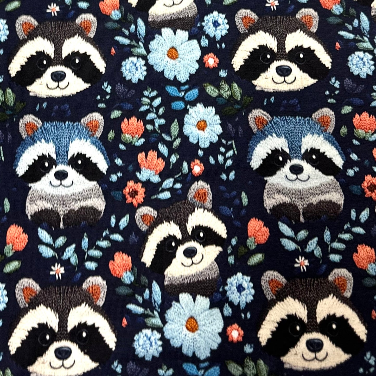 Embroidered Raccoons on Blue Bamboo/Spandex Jersey Fabric