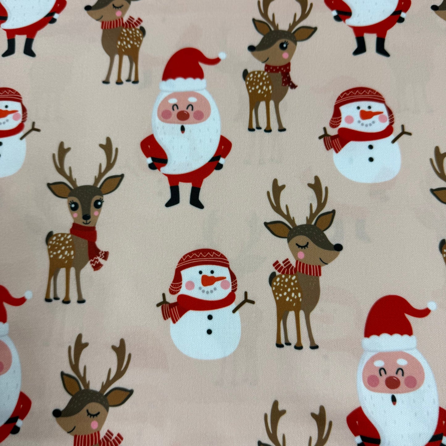 Santa and Reindeer on Peach 1 mil PUL Fabric - Made in China- Seconds