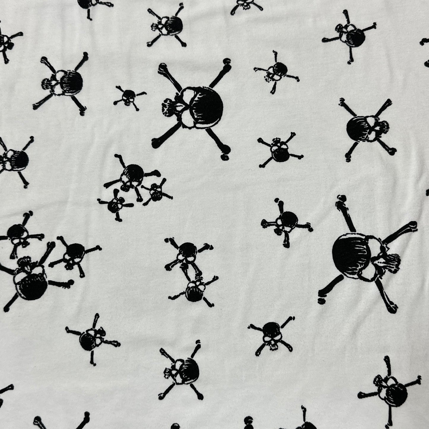 Black Skulls on White Cotton Interlock Fabric