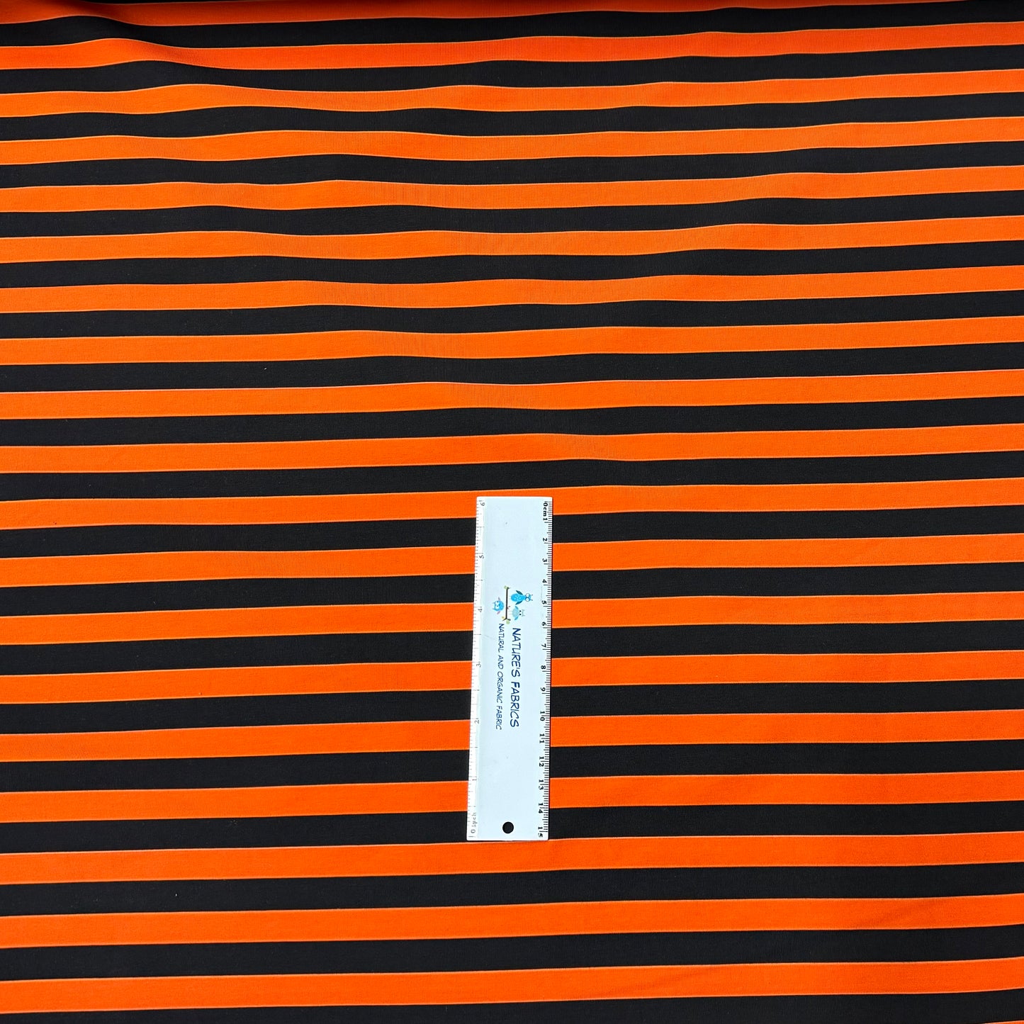 Black and Orange Stripes on Cotton/Spandex Jersey Fabric