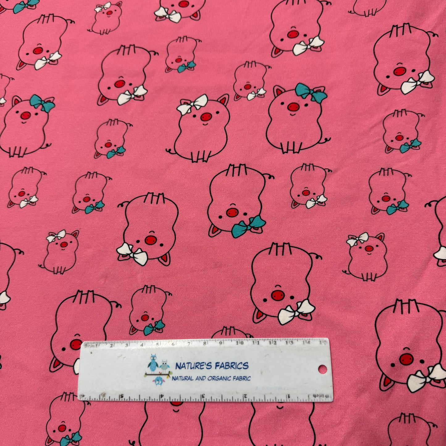 Pink Pigs on Pink Cotton/Spandex Jersey Fabric