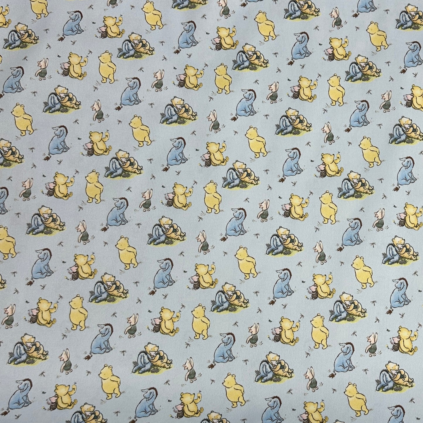 Winnie the Pooh and Friends on Blue 1 mil PUL Fabric - Made in the USA