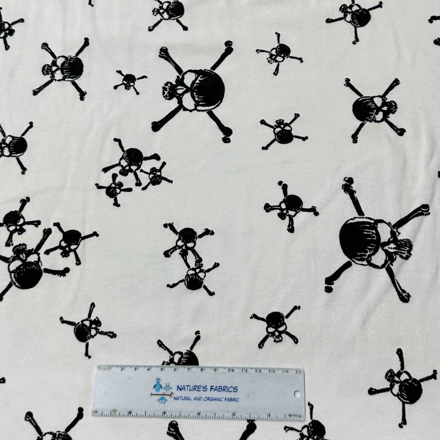 Black Skulls on White Cotton Interlock Fabric