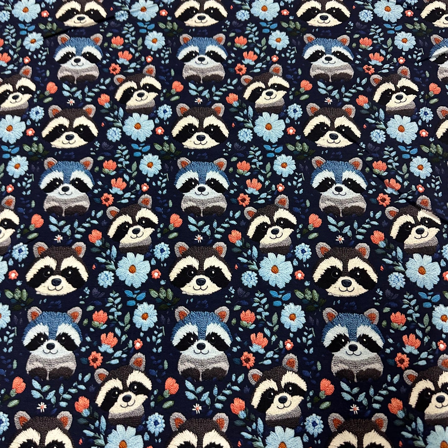 Embroidered Raccoons on Blue Bamboo/Spandex Jersey Fabric