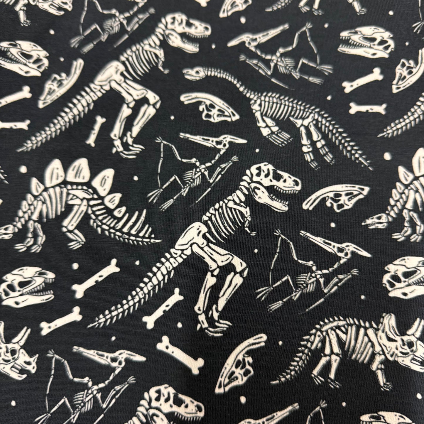 Dino Skeletons on Organic Cotton/Spandex Jersey Fabric